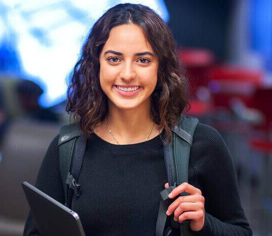 Student with backpack and tablet 